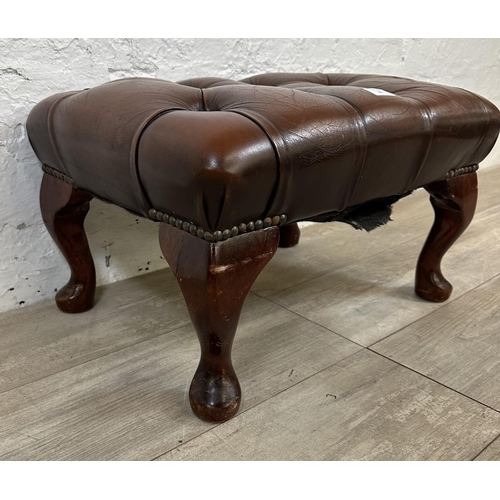 86 - A brown leather Chesterfield footstool on mahogany cabriole supports - approx. 33cm high x 56cm wide... 