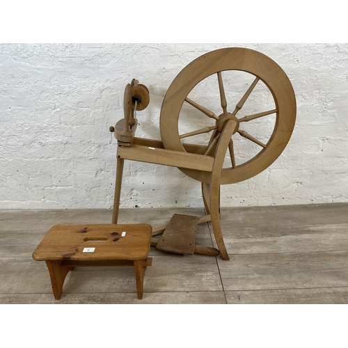 89 - Two items, one beech traditional spinning wheel - approx. 84cm high and one pine farmhouse stool