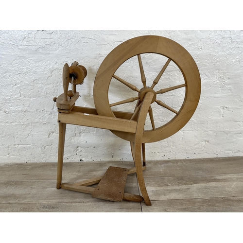 89 - Two items, one beech traditional spinning wheel - approx. 84cm high and one pine farmhouse stool