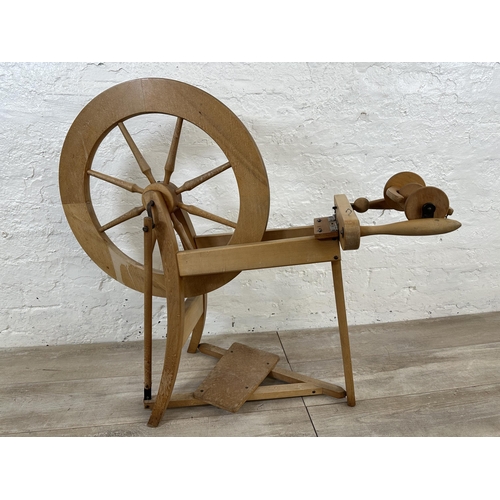 89 - Two items, one beech traditional spinning wheel - approx. 84cm high and one pine farmhouse stool