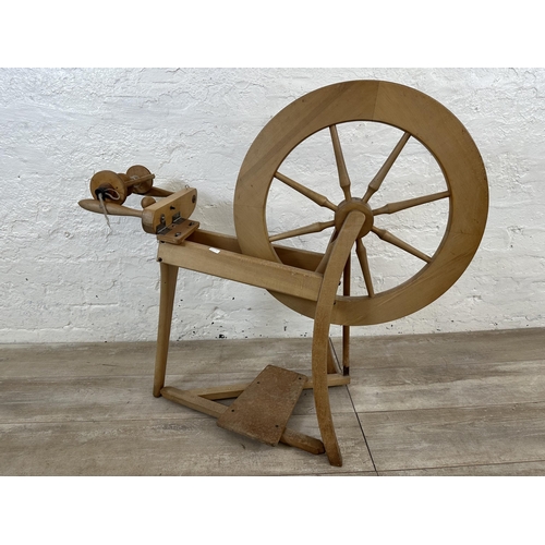 89 - Two items, one beech traditional spinning wheel - approx. 84cm high and one pine farmhouse stool