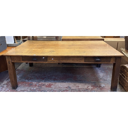 90 - An early 20th century solid oak farmhouse dining table - approx. 75cm high x 105cm wide x 213cm long