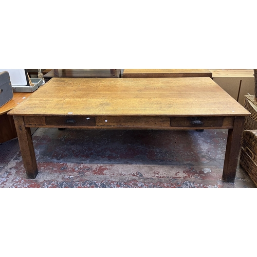 90 - An early 20th century solid oak farmhouse dining table - approx. 75cm high x 105cm wide x 213cm long