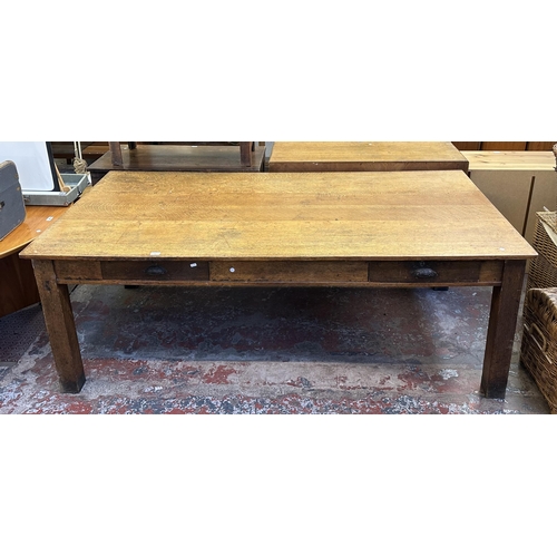 90 - An early 20th century solid oak farmhouse dining table - approx. 75cm high x 105cm wide x 213cm long