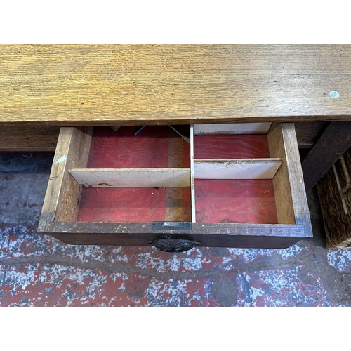 90 - An early 20th century solid oak farmhouse dining table - approx. 75cm high x 105cm wide x 213cm long