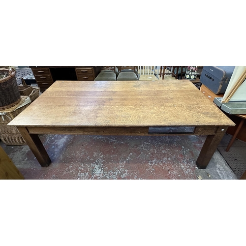 90 - An early 20th century solid oak farmhouse dining table - approx. 75cm high x 105cm wide x 213cm long