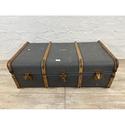 91 - Two mid 20th century items, one blue painted beech banded travel trunk and one cased Lumaplak Super ... 