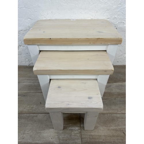 97 - A modern white painted pine nest of three tables - approx. 51cm high x 58cm wide x 38cm deep