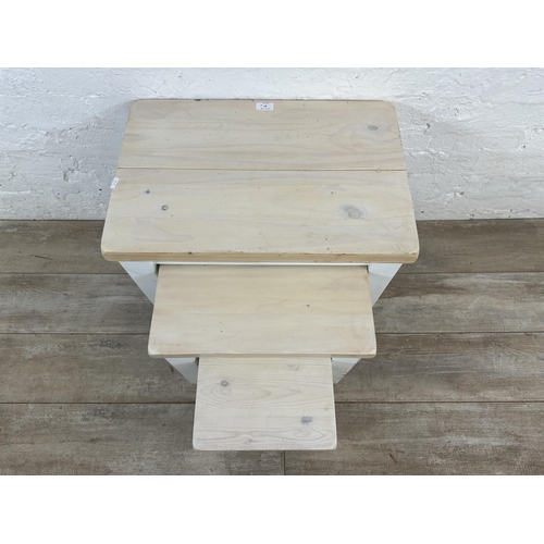 97 - A modern white painted pine nest of three tables - approx. 51cm high x 58cm wide x 38cm deep