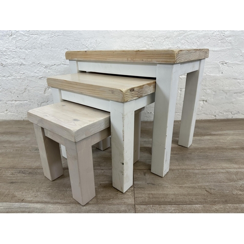 97 - A modern white painted pine nest of three tables - approx. 51cm high x 58cm wide x 38cm deep