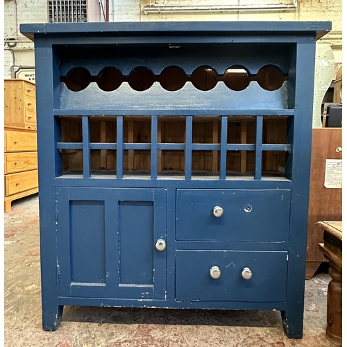 98 - A modern blue painted pine bottle rack cabinet - approx. 104cm high x 97cm wide x 37cm deep