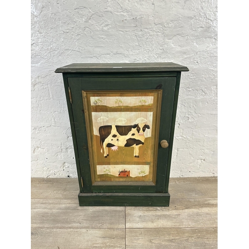 119 - A hand painted pine cabinet with cow design - approx. 79cm high x 55cm wide x 27cm deep