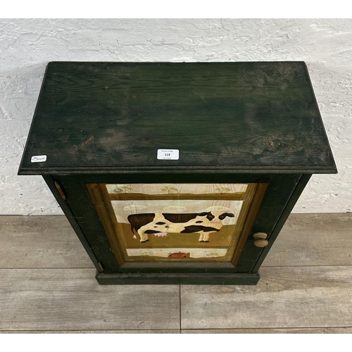 119 - A hand painted pine cabinet with cow design - approx. 79cm high x 55cm wide x 27cm deep