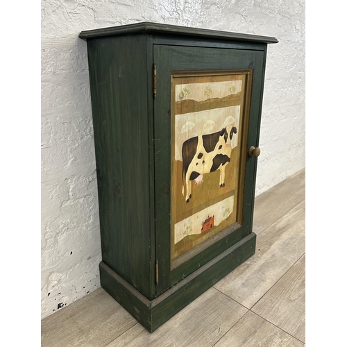 119 - A hand painted pine cabinet with cow design - approx. 79cm high x 55cm wide x 27cm deep