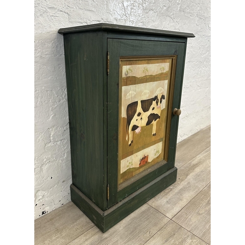 119 - A hand painted pine cabinet with cow design - approx. 79cm high x 55cm wide x 27cm deep