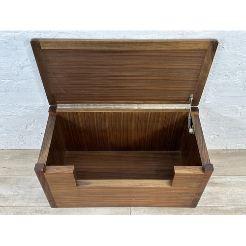 98A - A contemporary walnut blanket box on castors - approx. 47cm high x 80cm wide x 40cm deep