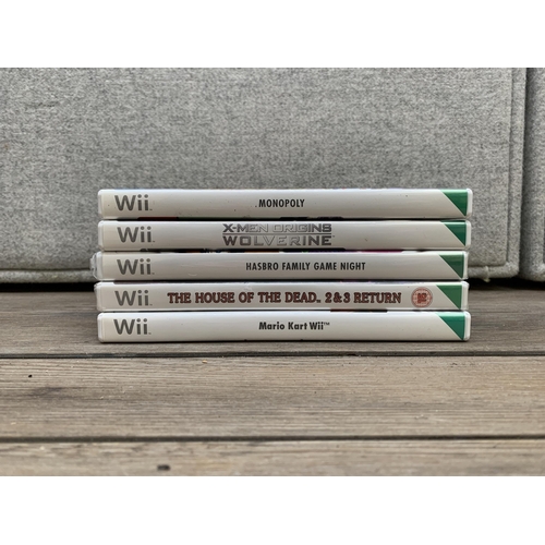 766 - A collection of Nintendo Wii items to include console, games, remote controls etc.