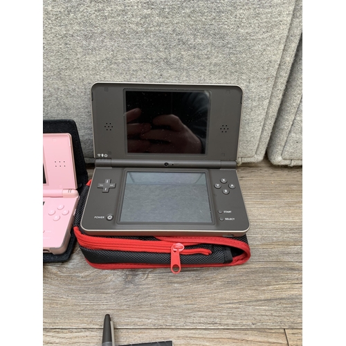 772 - Two cased Nintendo handheld game consoles, one DS XL with charger and one DS Lite with accessories a... 