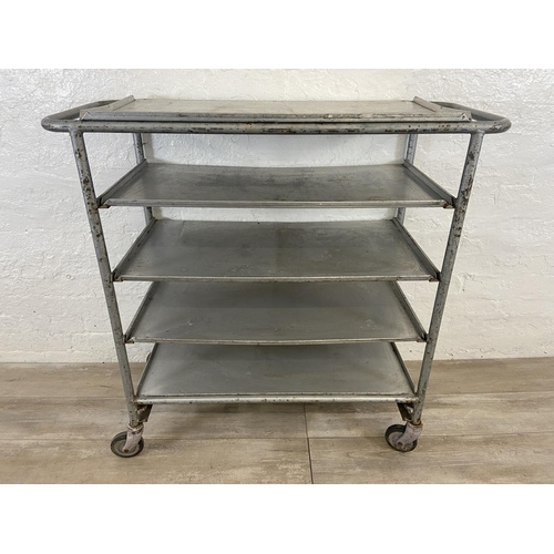 215 - A mid 20th century steel and aluminium five tier catering trolley - approx. 105cm high x 45cm wide x... 