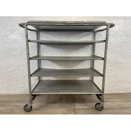 215 - A mid 20th century steel and aluminium five tier catering trolley - approx. 105cm high x 45cm wide x... 