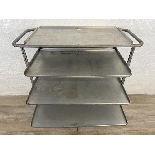 215 - A mid 20th century steel and aluminium five tier catering trolley - approx. 105cm high x 45cm wide x... 