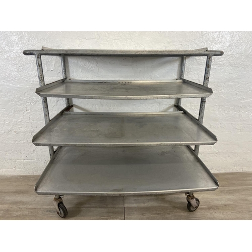 215 - A mid 20th century steel and aluminium five tier catering trolley - approx. 105cm high x 45cm wide x... 