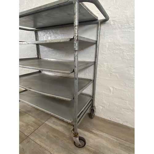 215 - A mid 20th century steel and aluminium five tier catering trolley - approx. 105cm high x 45cm wide x... 