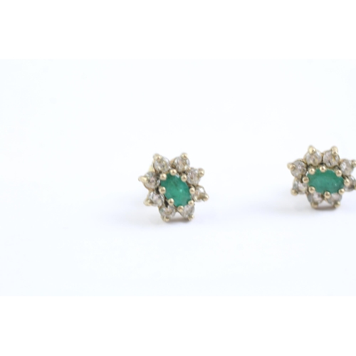 2002 - A pair of 9ct gold emerald and CZ floral cluster earrings - approx. gross weight 1.2g