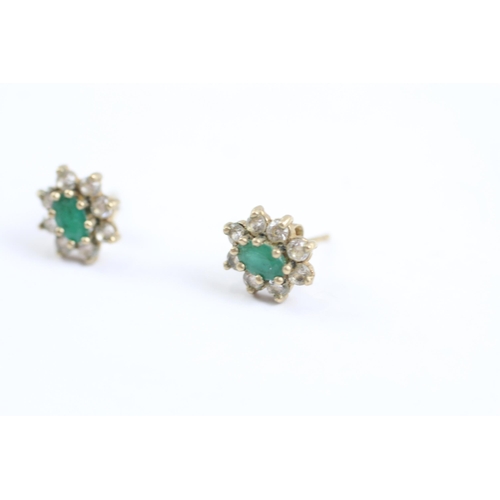 2002 - A pair of 9ct gold emerald and CZ floral cluster earrings - approx. gross weight 1.2g