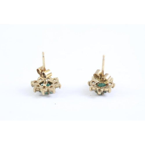 2002 - A pair of 9ct gold emerald and CZ floral cluster earrings - approx. gross weight 1.2g