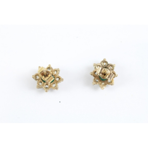 2002 - A pair of 9ct gold emerald and CZ floral cluster earrings - approx. gross weight 1.2g