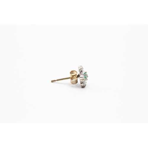 2028 - A pair of 9ct gold emerald and clear gemstone floral stud earrings - approx. gross weight 0.7g