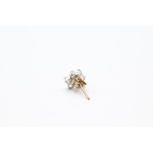 2028 - A pair of 9ct gold emerald and clear gemstone floral stud earrings - approx. gross weight 0.7g