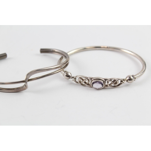 2036 - Three sterling silver bangles, one Celtic, one mother of pearl and one twist - approx. gross weight ... 