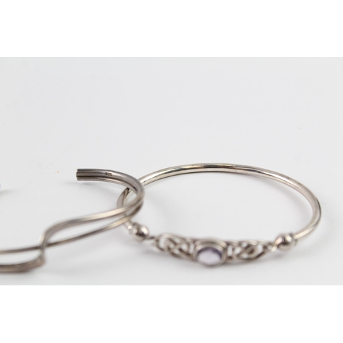 2036 - Three sterling silver bangles, one Celtic, one mother of pearl and one twist - approx. gross weight ... 