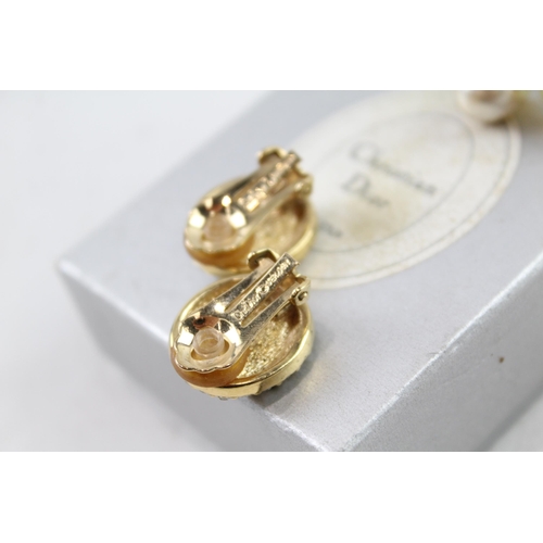 2050 - Two pairs of Christian Dior gold tone earrings, one clip ons and one studs - approx. gross weight 17... 