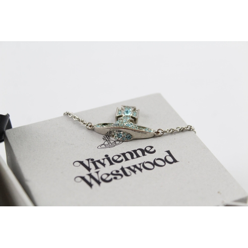 2056 - Two boxed pieces of Vivienne Westwood silver tone orb jewellery, one bracelet and one pendant neckla... 