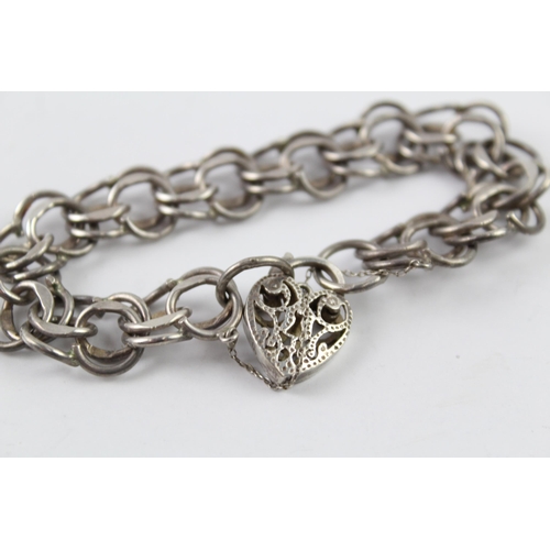 2061 - A sterling silver gate bracelet with cut work heart padlock clasp - approx. gross weight 28g