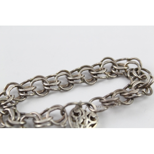 2061 - A sterling silver gate bracelet with cut work heart padlock clasp - approx. gross weight 28g