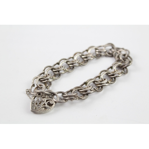 2061 - A sterling silver gate bracelet with cut work heart padlock clasp - approx. gross weight 28g