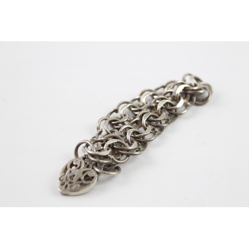 2061 - A sterling silver gate bracelet with cut work heart padlock clasp - approx. gross weight 28g