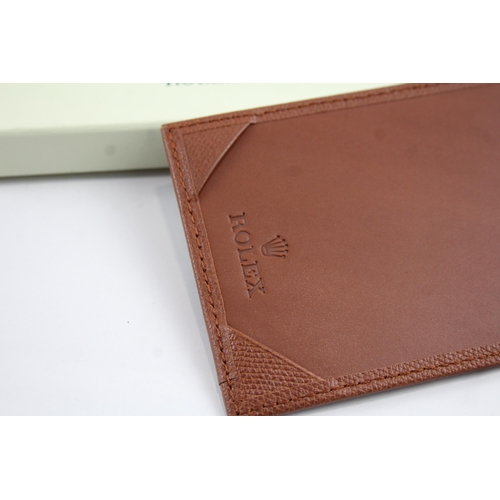 2138 - A boxed Rolex brown leather pocket notebook