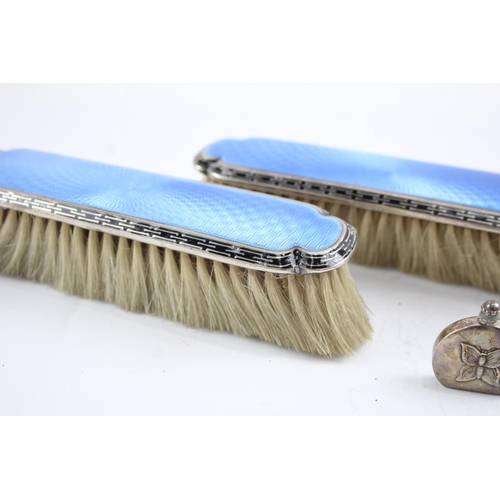 2171 - Seven sterling silver lady's vanity items to include two guilloche enamel hairbrushes, silver pen kn... 