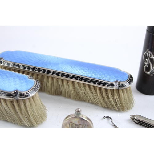 2171 - Seven sterling silver lady's vanity items to include two guilloche enamel hairbrushes, silver pen kn... 