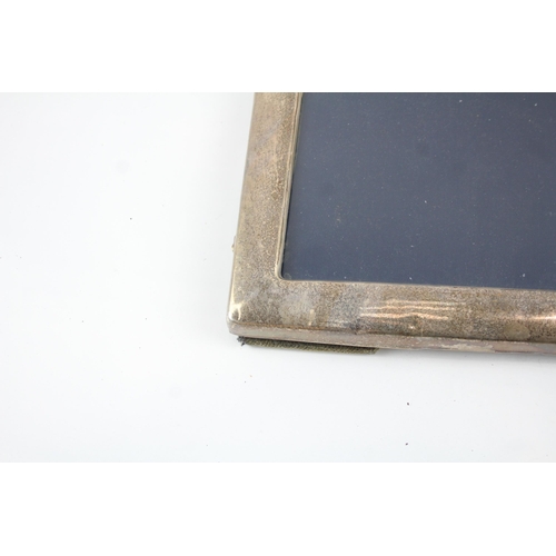 2172 - Three hallmarked sterling silver photo frames - largest approx. 22.5cm x 17.5cm