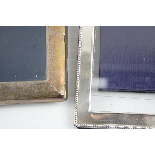 2172 - Three hallmarked sterling silver photo frames - largest approx. 22.5cm x 17.5cm