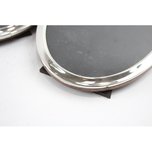 2173 - Three sterling silver oval photograph frames - largest approx. 17cm x 12cm