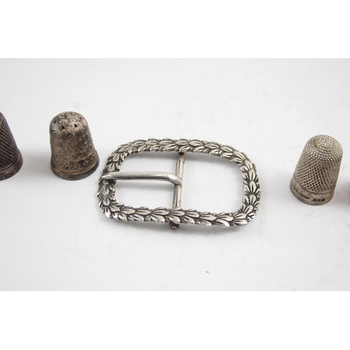 2177 - Seven pieces of silver, one .800 thimble, one .800 belt buckle and six hallmarked sterling silver th... 