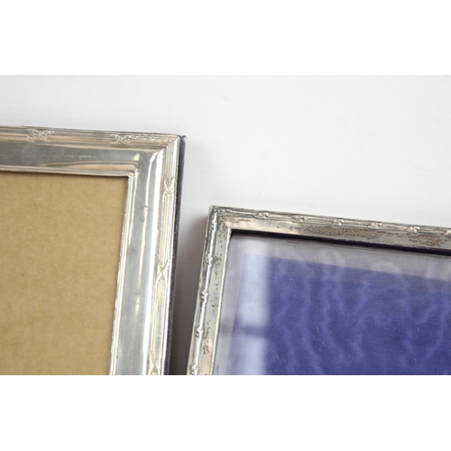 2180 - Three hallmarked sterling silver photo frames - largest approx. 25cm x 20cm