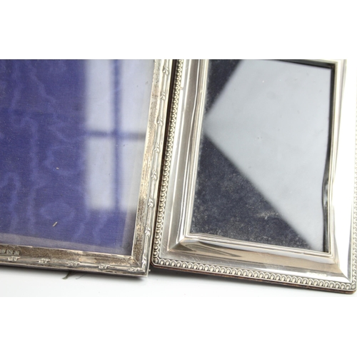 2180 - Three hallmarked sterling silver photo frames - largest approx. 25cm x 20cm